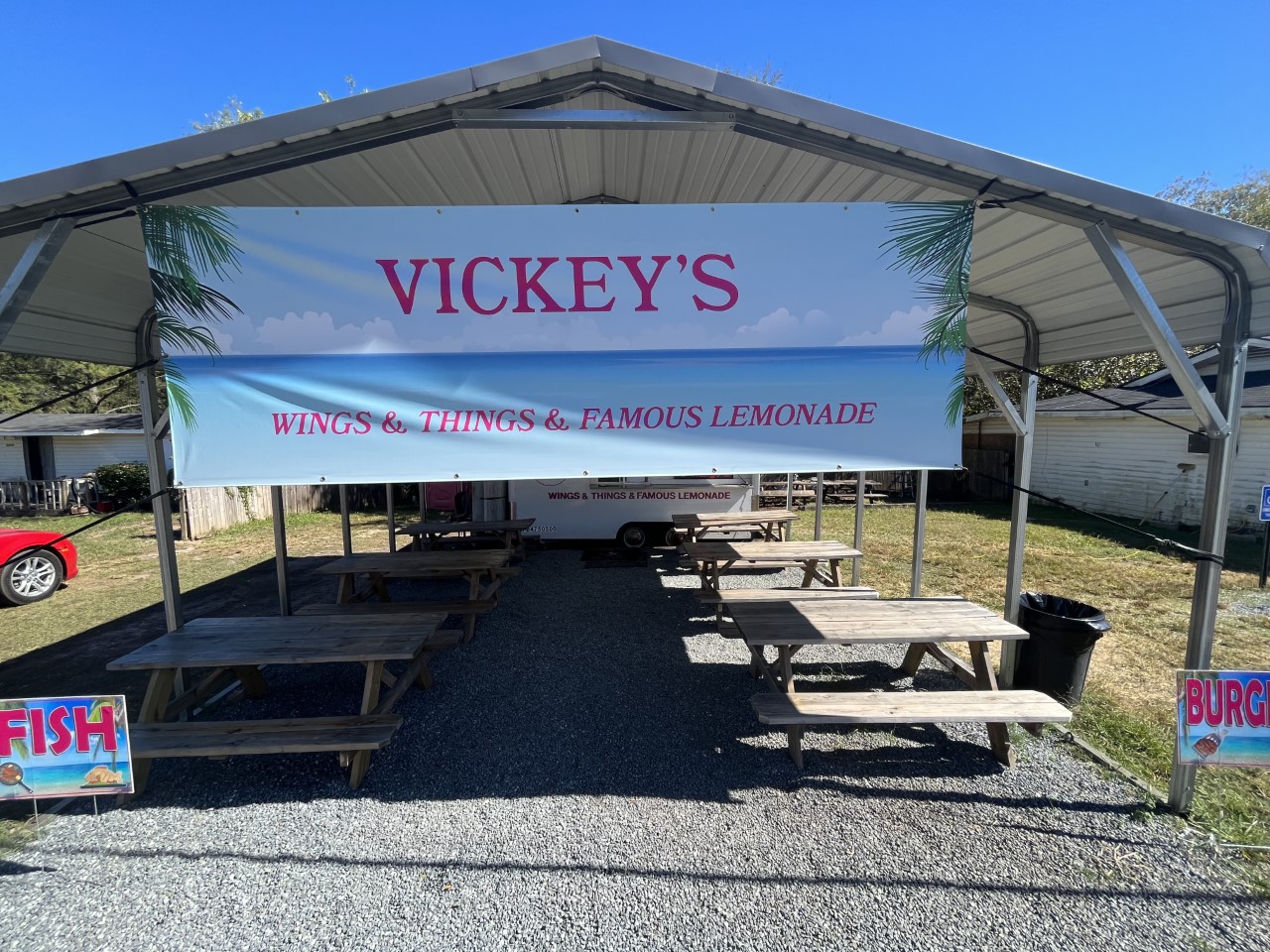 Vickey's Kitchen covered porch with picnic tables and chairs